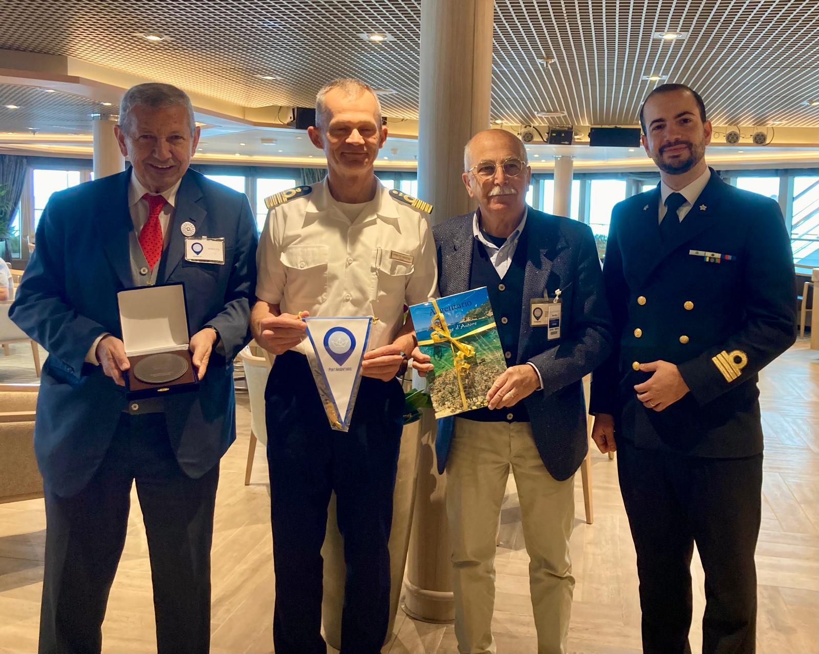 As this was Silver Muse’s maiden call in Argentario and also the first call of the season, the traditional plaque exchange ceremony took place on board. The Mayor of Argentario, Arturo Cerulli, together with the Harbour Master, T.V. (CP) Francesco Luigi Balsamo, and Fabrizio Palombo, Technical Manager of the PORTARGENTARIO hospitality project, officially welcomed the ship’s Captain and thanked him for the call.  (Image at LateCruiseNews.com - March 2026)
